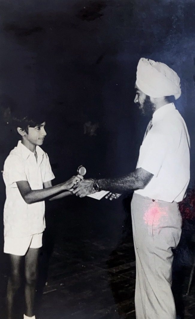A young Rajiv Sachdev receiving another award
