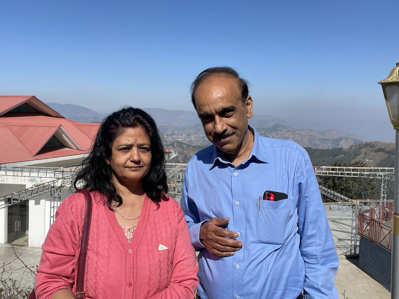 Rajiv Sachdev with his wife overlooking the Shimla valley