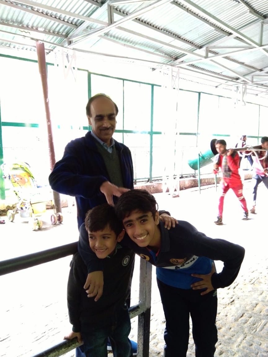 Rajiv Sachdev with two young boys at a park
